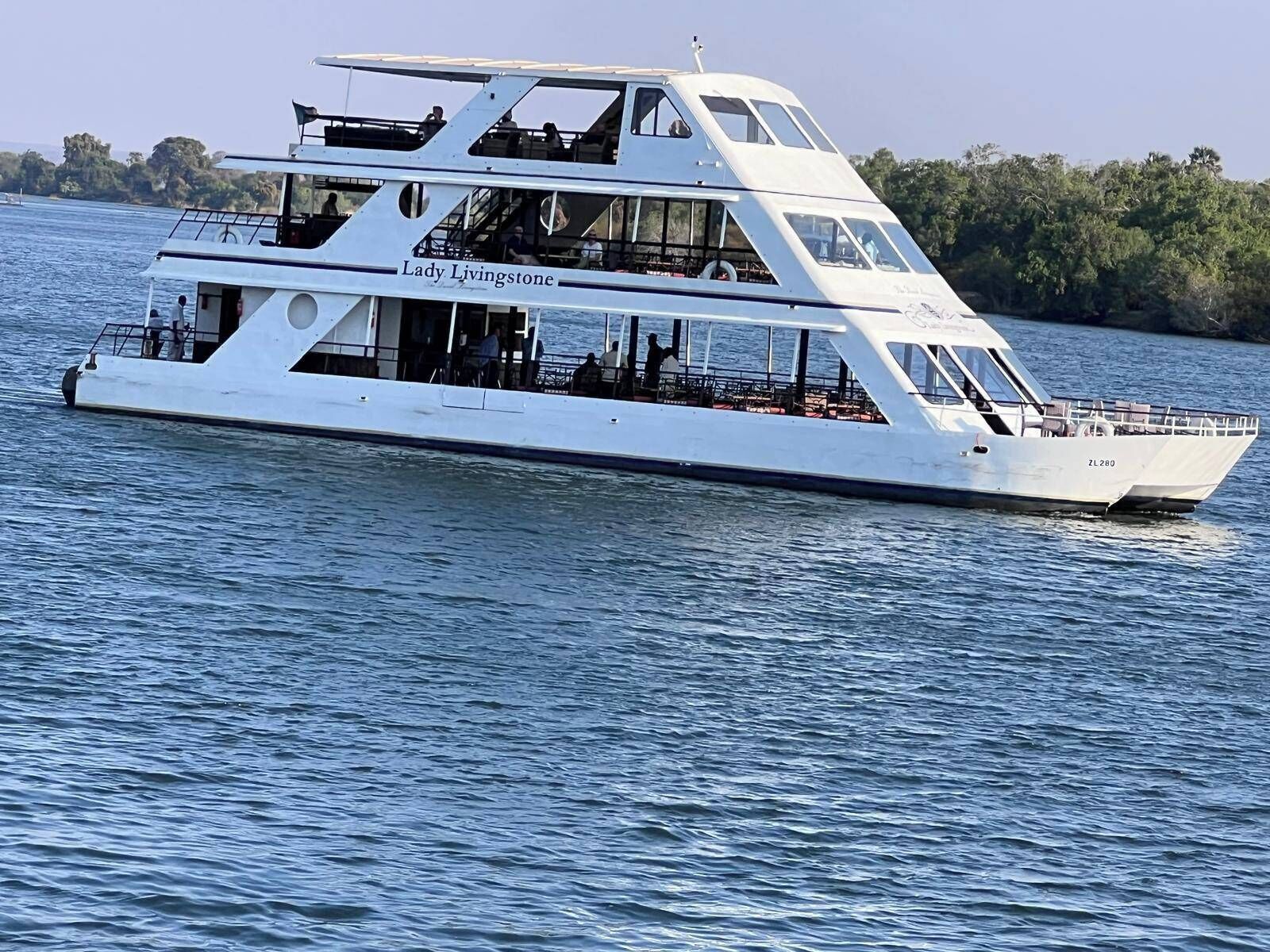 A multi-deck boat named Lady Livingstone with a spacious upper deck and a lower deck seating area.