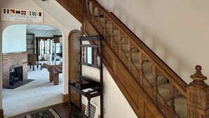 A wooden staircase with a handrail and a light fixture above. - Large Waterfront Lake Michigan - Book Fall Colors! (Menominee)