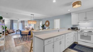 A modern kitchen with white cabinets, a built-in oven, and a microwave. - Ion by Avantstay Walk to Beach, Dining, Shopping Central Location Deck (Sullivan's Island)