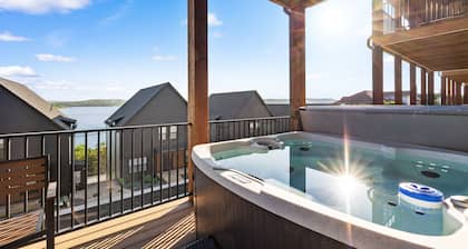 New 7 bdrm home (sleeps 28) w/ lake views, hot tub, & outdoor dining!