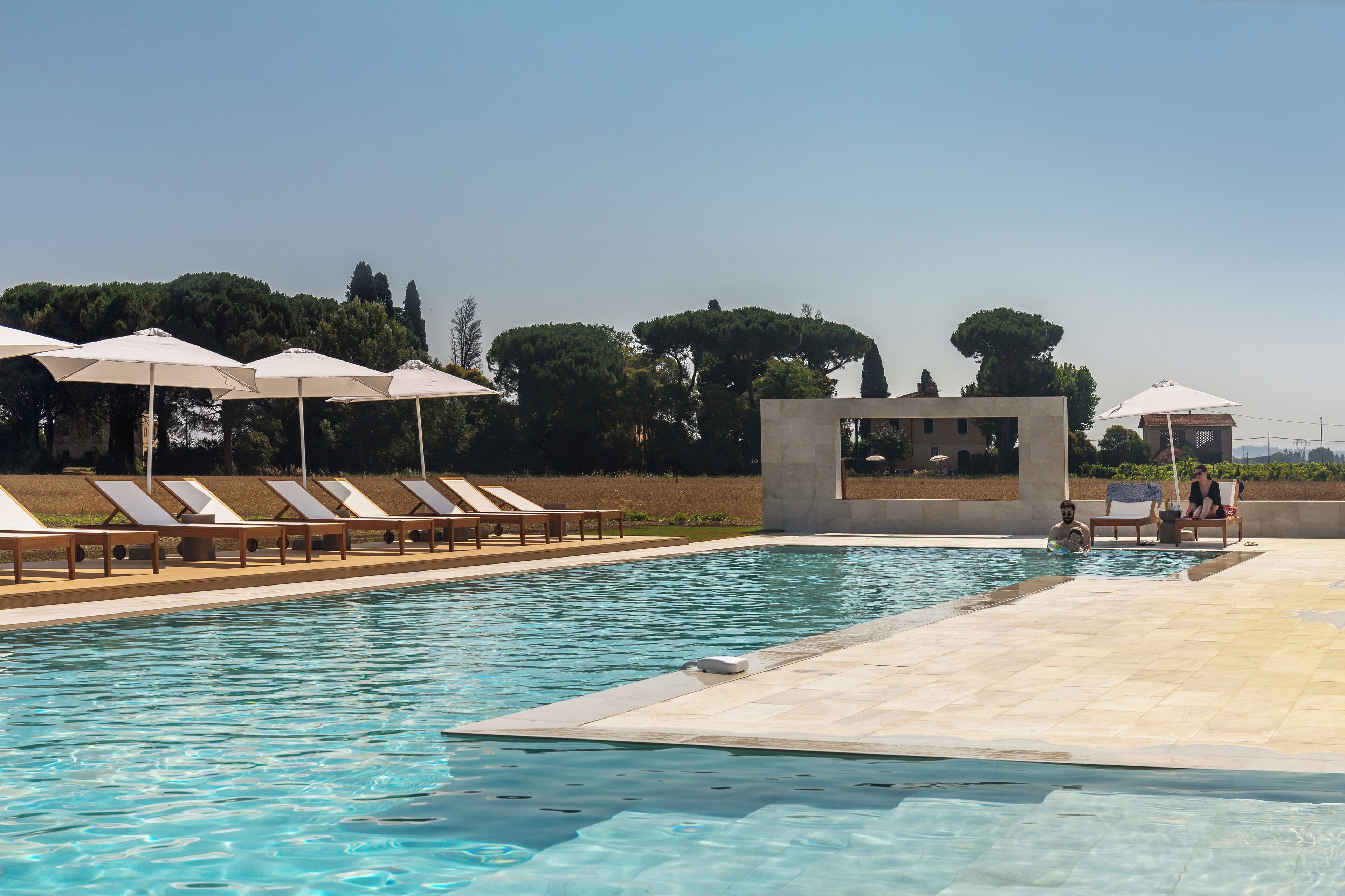 Outdoor pool, open 8:00 AM to 8:00 PM, pool umbrellas, pool loungers
