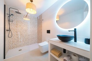 Shower, hair dryer, towels, soap