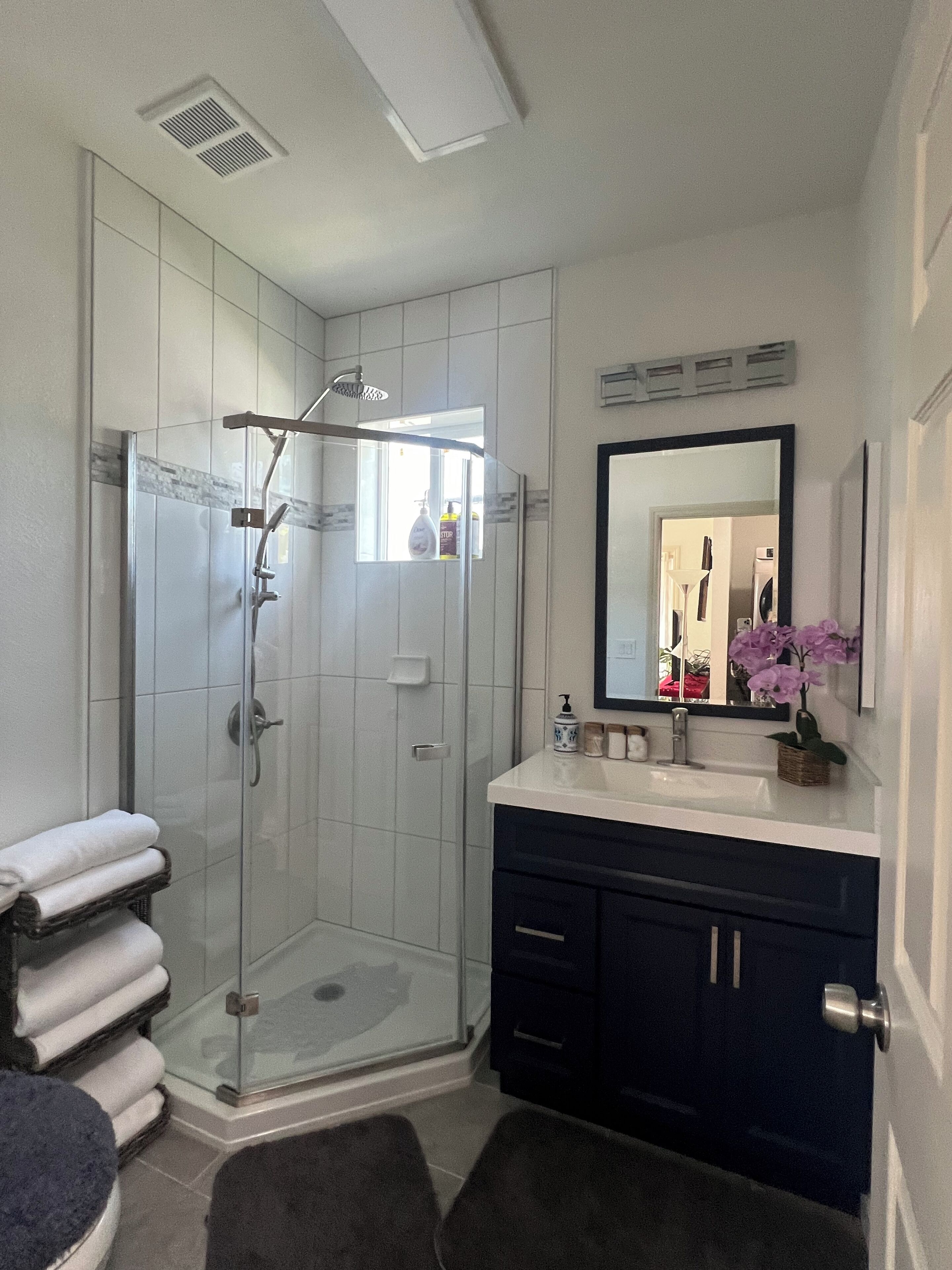 Shower, hair dryer, towels, soap