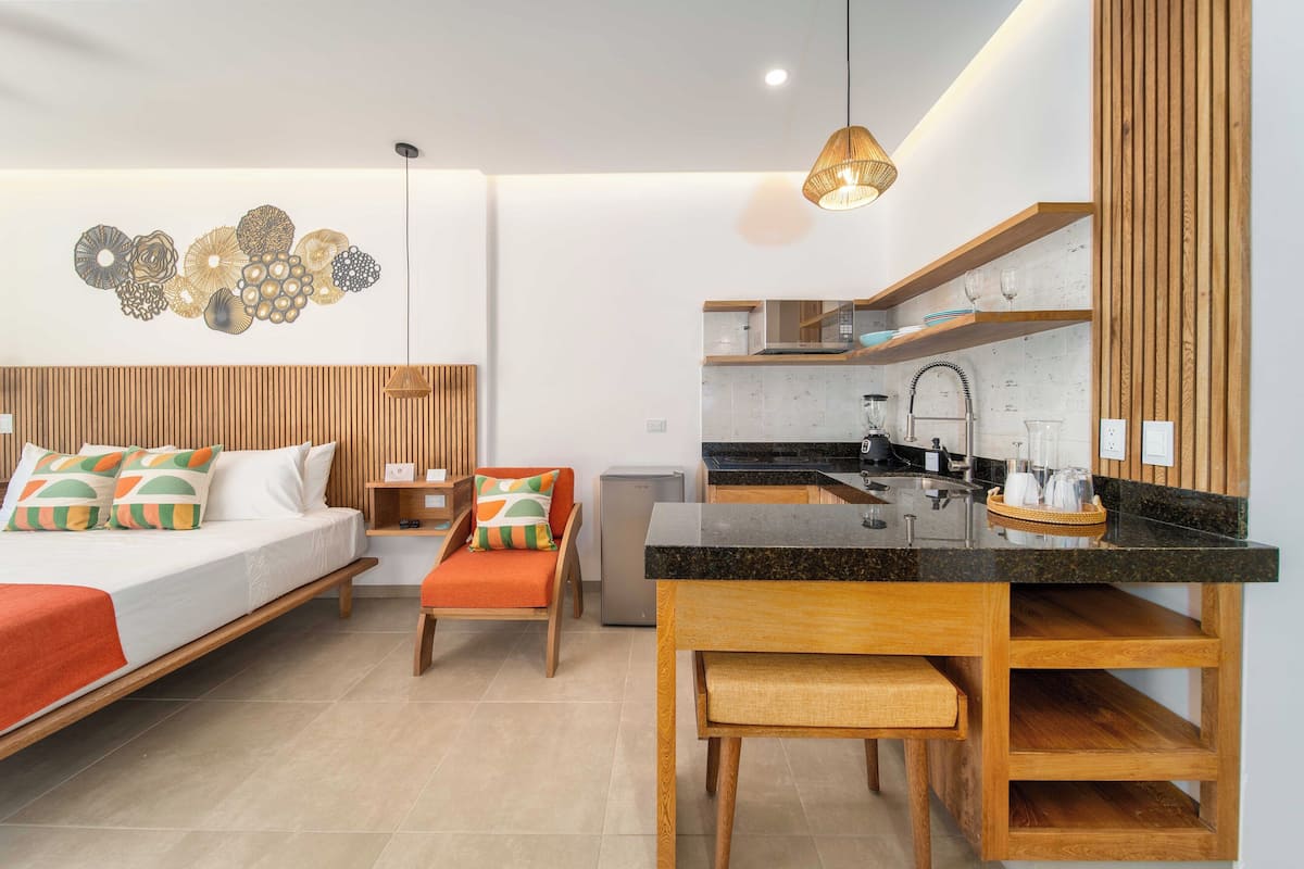 Deluxe Studio, 1 King Bed, Kitchenette, Pool View | Premium bedding, in-room safe, blackout drapes, iron/ironing board