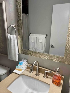 Shower, hair dryer, towels, soap