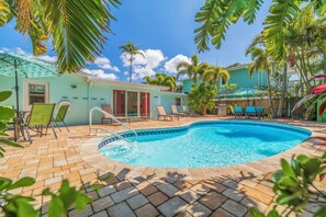 A heated pool - Tropical Gateway—Colorful Pool Retreat w/ Fenced Yard, Beach Gear & Walk-to-Beach Access (Indian Rocks Beach)