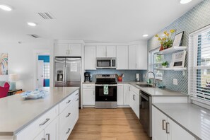 Fridge, microwave, oven, stovetop - Tropical Gateway—Colorful Pool Retreat w/ Fenced Yard, Beach Gear & Walk-to-Beach Access (Indian Rocks Beach)