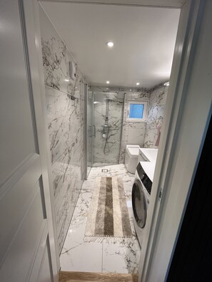 Shower, hair dryer, towels, soap