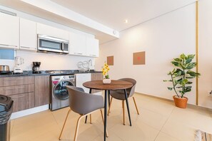 Fridge, microwave, stovetop, coffee/tea maker