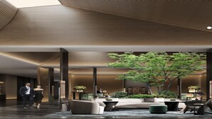 A modern lobby with a central seating area, a large tree, and a reception desk. - Intercontinental Xiangyang by IHG (Xiangyang)