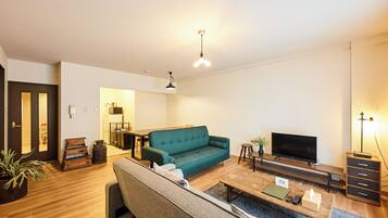 Family Apartment | Living area | 50-inch flat-screen TV with digital channels, offices