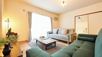 Family Apartment | Living area | 50-inch flat-screen TV with digital channels, offices