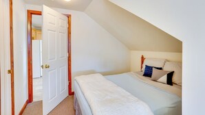 A bedroom with a bed, a door, and a ceiling light. - Loganton Townhome, Near Fly Fishing & Hiking! (Loganton)