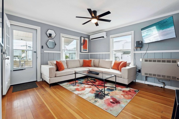 Relaxing lounge area with an inviting sofa and smart TV!