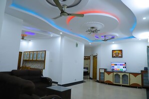 Apartment, 3 Bedrooms | Living area | 53-inch LED TV with digital channels, Netflix, first-run movies - NANDA MOHAN HOMESTAY (Tirupati)