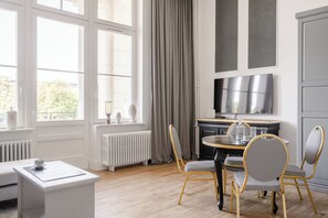 Exclusive Studio Suite, City View | Living room | 37-inch flat-screen TV with satellite channels, streaming services