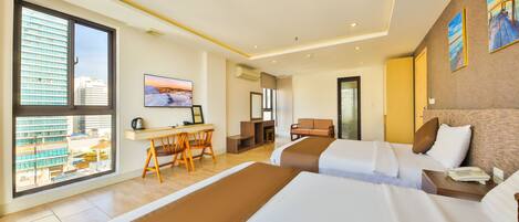 A hotel room with two beds, a desk, a chair, and a large window offering a city view.