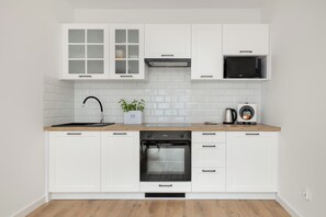 Studio, Balcony | Private kitchen | Microwave, dishwasher, coffee/tea maker, cookware/dishes/utensils - Bright Studio in Darlowo by Renters (Darlowo)