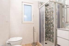 Basic Double Room, 1 Queen Bed, Private Bathroom | Bathroom | Shower, hair dryer, towels, soap