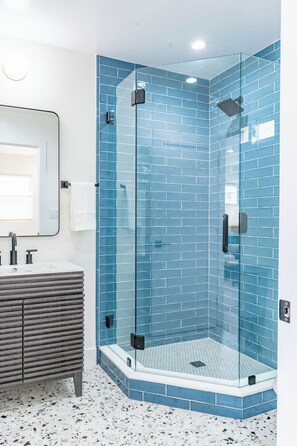 Shower, hair dryer, towels, shampoo