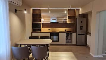 Deluxe Apartment | Living area | TV