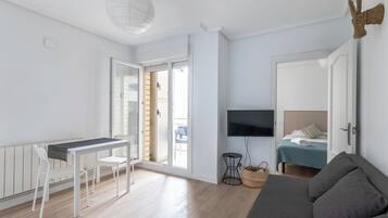 Comfort Apartment, Balcony, Partial Sea View | Living area | 24-inch flat-screen TV with cable channels
