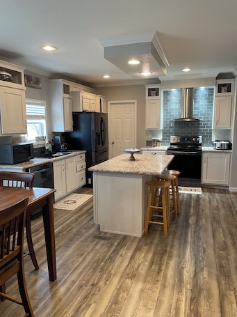 Fridge, microwave, oven, stovetop. Ranch house, cottage, pool, deck, small basketball court, private gated entrance
