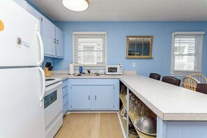 Coffee/tea maker, fridge, stovetop, toaster