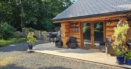 Includes admission to Hoo Zoo and Dinosaur World. Log cabin with hot tub.