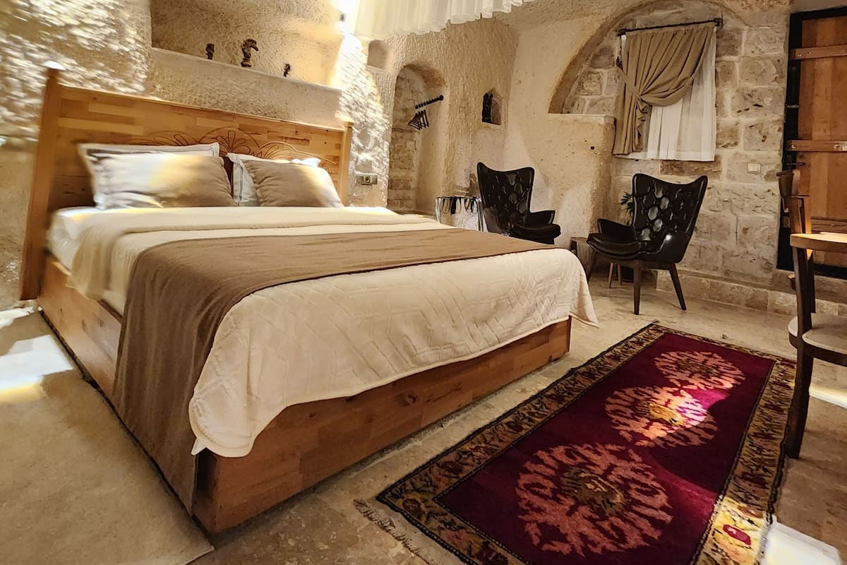 Nesha Cave Suite | Premium bedding, memory foam beds, minibar, in-room safe