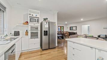 Fridge, stovetop, dishwasher, coffee/tea maker