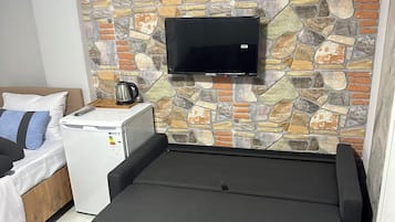 Family Condo | Living area | 6-inch flat-screen TV with satellite channels
