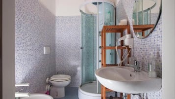 Shower, hair dryer, towels, toilet paper