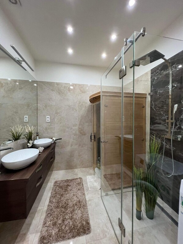Shower, hair dryer, towels, soap