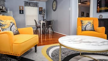 Apartment, City View | Living area | 60-inch Smart TV with cable channels