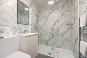 Shower, hair dryer, towels, soap