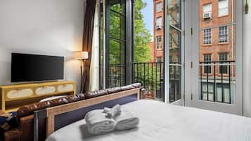 1 bedroom, desk, iron/ironing board, travel crib