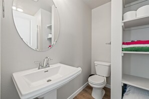 Shower, towels, soap, toilet paper