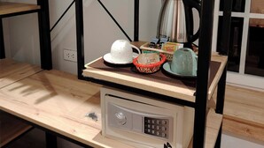 A kitchenette with a microwave, kettle, and tea set on a wooden shelf. - Casa Cruz Verde by Peru Garden Hotels (Cusco)