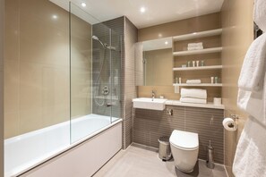 Combined shower/bathtub, free toiletries, hair dryer, heated floors