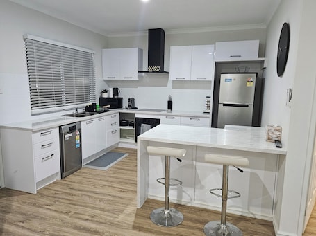 Fridge, microwave, oven, stovetop. 3 Bedroomed Deluxe Holiday and Business Villa