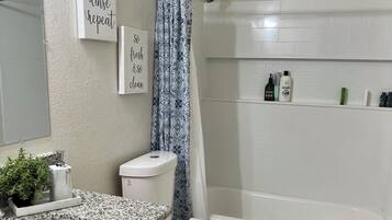 Hair dryer, towels, soap, shampoo
