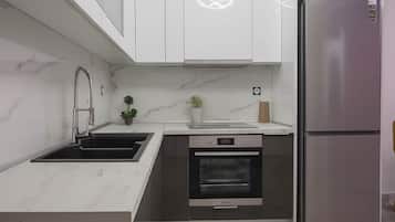 Fridge, oven, cookware/dishes/utensils
