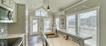 Park Model Cabin with Queen Loft - One queen bed in the private bedroom and one queen bed in the open loft.