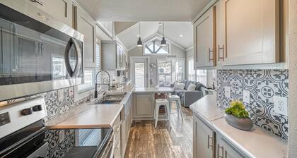 Park Model Cabin - Twin Loft - One queen bed in the private bedroom, with two twin beds in the open loft.