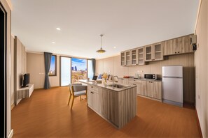 Family Suite | Living area | 32-inch TV with cable channels