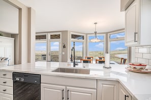 Fridge, microwave, oven, stovetop - Modern Main Floor Waterfront Condo (Manistee)
