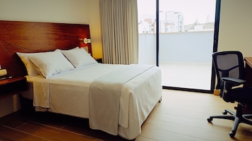 Habitación individual ejecutiva | Minibar, caja fuerte, wifi gratis y ropa de cama