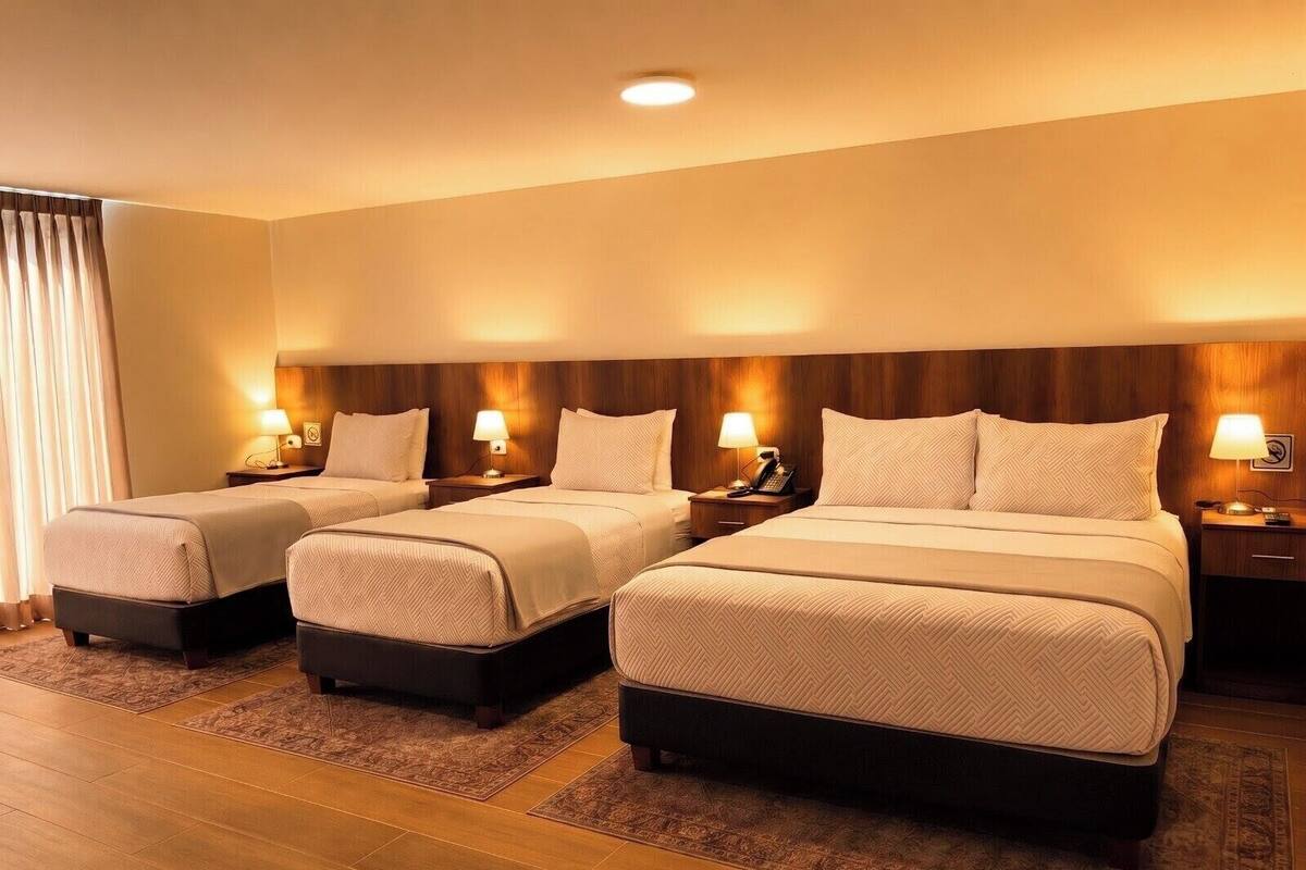 Executive Quadruple Room | Minibar, in-room safe, desk, free WiFi