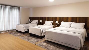 Executive Quadruple Room | Minibar, in-room safe, free WiFi, bed sheets
